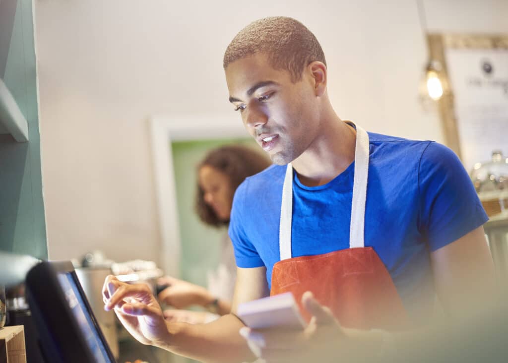 Teen Restaurant Worker at POS